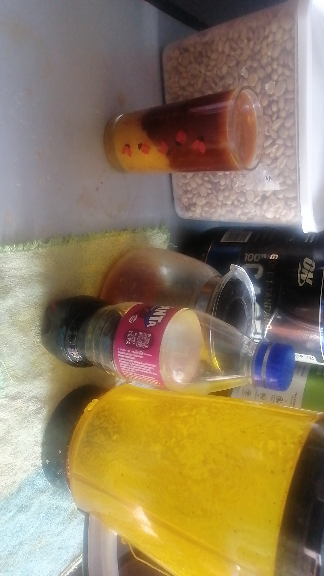 A blackcurrant espresso tonic carefully poured into a pawpaw passionfruit juice next to a blackcurrant soda and filter espresso equipment